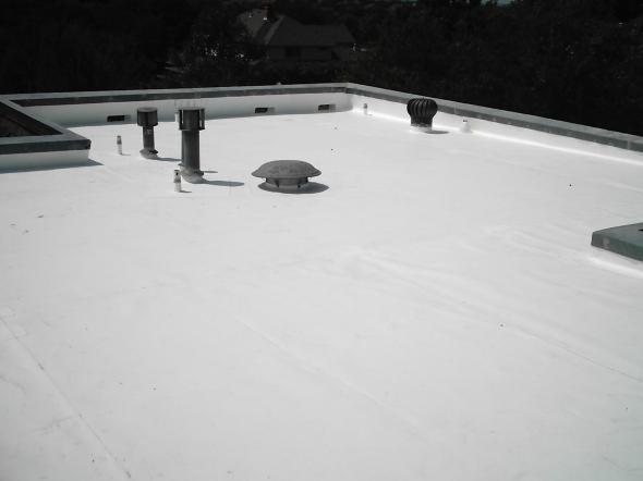 Upper view of a house roof in full white color