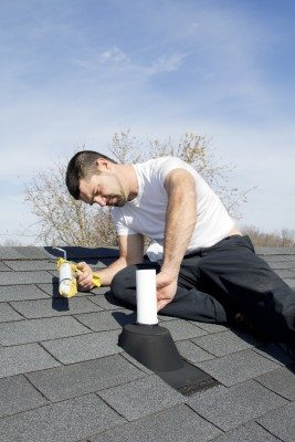 A Man Polishing And Repairing A Roof
