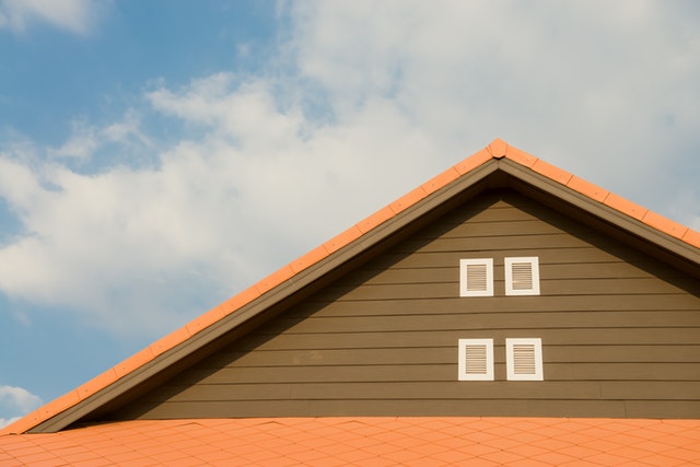 An Orange color newly made roofing and a blue sky