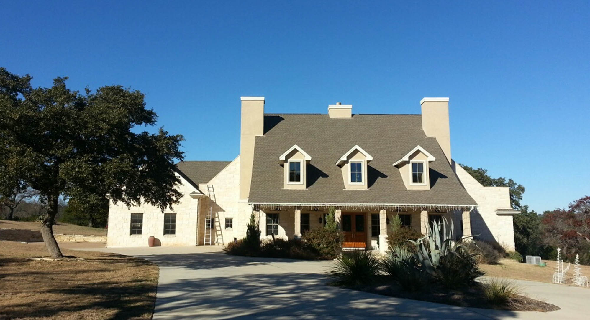 roof1 Stone house with three dormer windows